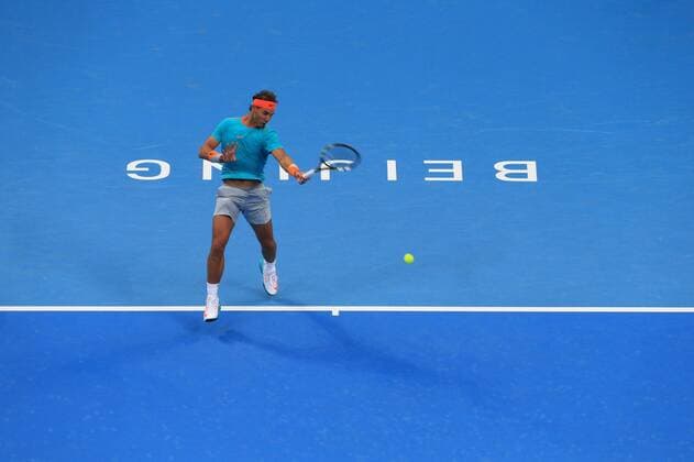 Rafael Nadal of Spain returns a hit during the men s singles 1st round match at the 2014 China Open in Beijing, capital of China, on Sept. 30, 2014. XingxGuangli 