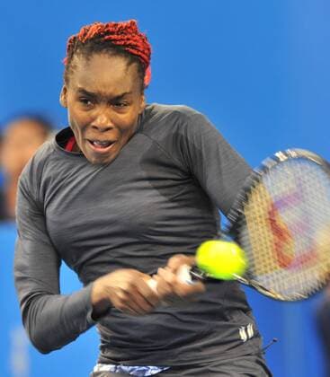 Venus Williams of the United States returns a hit during the women s 2nd round match at the 2014 China Open in Beijing, capital of China, on Sept. 30, 2014. LixWen 