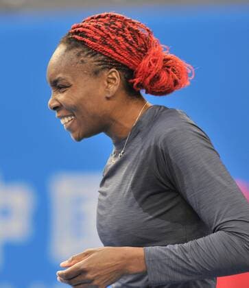 Venus Williams of the United States reacts during the women s 2nd round match at the 2014 China Open in Beijing, capital of China, on Sept. 30, 2014. LixWen 