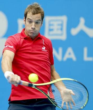 Richard Gasquet of France returns a hit during the men s singles 1st round match at the 2014 China Open in Beijing, capital of China, on Sept. 30, 2014. ChenxJianLi 