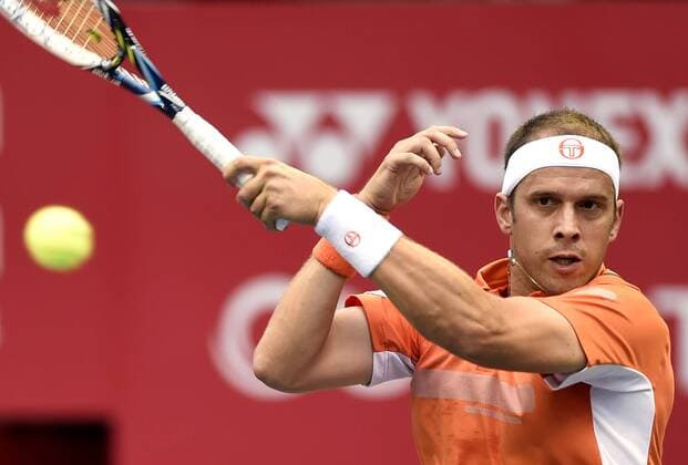 (141001) -- TOKYO, Oct. 1, 2014 -- Gilles Muller of Luxemburg hits a return during the second round match at the Rakuten Japan Open Tennis Championships 2014 in Tokyo, Japan, Oct. 1, 2014. ) (SP) JAPAN-TOKYO-TENNIS-JAPAN OPEN Stringer 