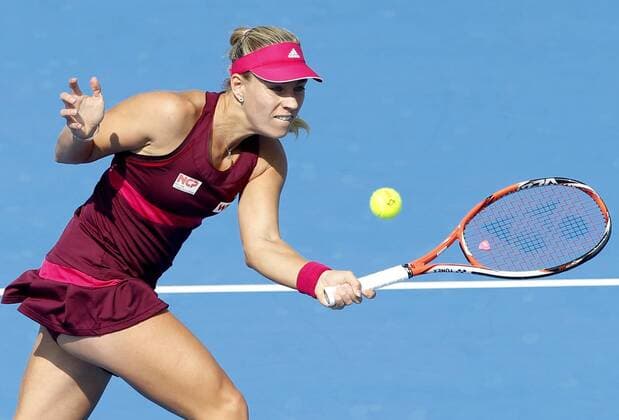(141002) -- BEIJING, Oct. 2, 2014 -- Germany s Angelique Kerber returns a hit during the women s third round match at the 2014 China Open in Beijing, capital of China, on Oct. 2, 2014. ChenxJianli 