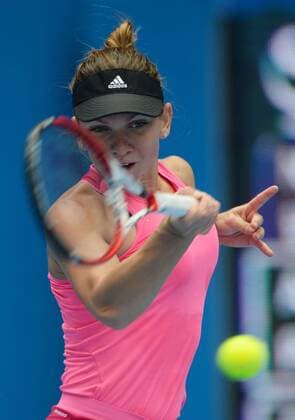 (141002) -- BEIJING, Oct. 2, 2014 -- Romania s Simona Halep returns the ball during the women s third round match at the 2014 China Open in Beijing, capital of China, on Oct. 2, 2014. ChenxYehua 