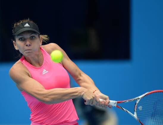 (141002) -- BEIJING, Oct. 2, 2014 -- Romania s Simona Halep returns the ball during the women s third round match at the 2014 China Open in Beijing, capital of China, on Oct. 2, 2014. ChenxYehua 
