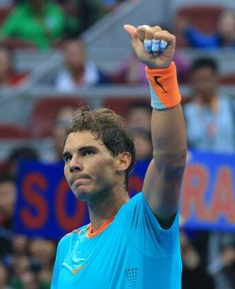 (141002) -- BEIJING, Oct. 2, 2014 -- Rafael Nadal of Spain jubilates after the men s singles 2nd round match at the China Open tennis tournament in Beijing, China, Oct. 2, 2014. XingxGuangli 