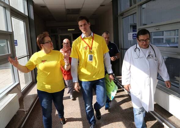 SARAJEVO, Oct. 6, 2014 -- Goalkeeper of the national soccer team of Bosnia and Herzegovina Asmir Begovic (C) visits a children s hospital for cancer treatment in Sarajevo to encourage sick children in Sarajevo, Bosnia-Herzegovina, on Oct. 6, 2014. ) (SP)BOSNIA AND HERZEGOVINA-SARAJEVO-SOCCER-ASMIR BEGOVIC-CHILDREN S HOSPITAL HarisxMemija 