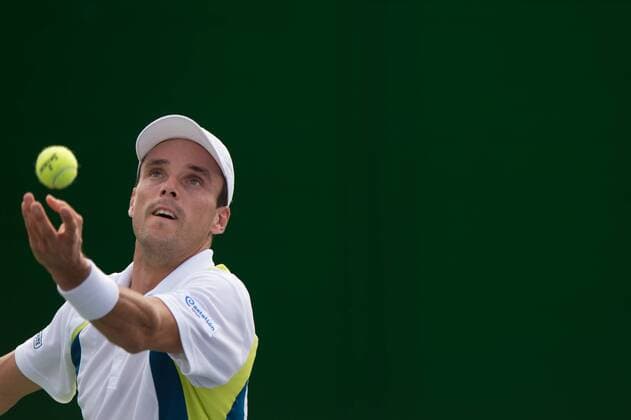 Roberto Bautista Agut of Spain returns a shot in the second round of the men s singles during the 2014 Shanghai Rolex Masters tennis tournament in Shanghai, China, 8 October 2014  20141008_28065