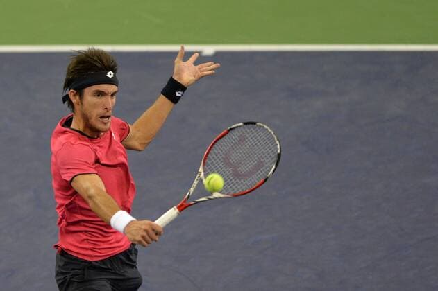 Florian Mayer of Germany returns a shot in the second round of the men s singles during the 2014 Shanghai Rolex Masters tennis tournament in Shanghai, China, 8 October 2014  20141008_31419