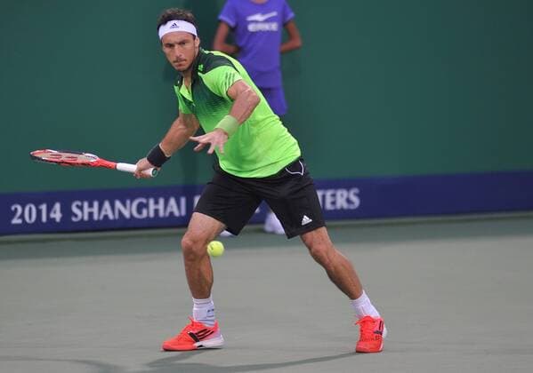 Juan Monaco of Argentina returns a shot in the third round of the men s singles during the 2014 Shanghai Rolex Masters tennis tournament in Shanghai, China, 9 October 2014. Shanghai Rolex Masters  20141009_09870