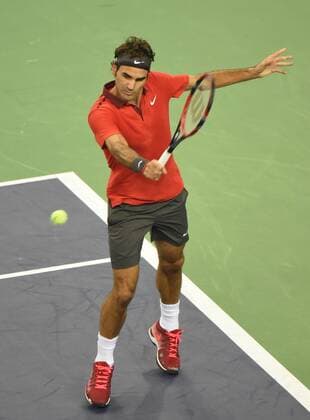 Roger Federer of Switzerland returns a shot in the semifinals of the men s singles during the 2014 Shanghai Rolex Masters tennis tournament in Shanghai, China, 11 October 2014.  20141011_30174