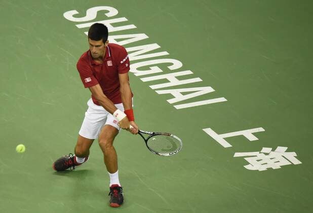 Novak Djokovic of Serbia returns a shot in the semifinals of the men s singles during the 2014 Shanghai Rolex Masters tennis tournament in Shanghai, China, 11 October 2014.  20141011_46183