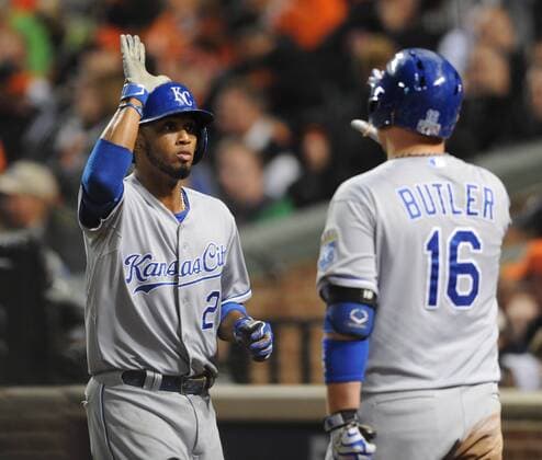 Kansas City Royals Alcides Escobar (L) is greeted by Billy Butler after scoring against the Baltimore Orioles in the ninth inning of game 2 of the American League Championship Series at Orioles Park at Camden Yards in Baltimore, Maryland on October 11, 2014. Escobar batted in the winning run and laters cored as the Royals defeated the Orioles 6-4.  MGX20141011237