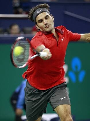 Roger Federer of Switzerland returns the ball during the men s singles final match at the Shanghai Masters tennis tournament in Shanghai, east China, Oct. 12, 2014. (SP)CHINA-SHANGHAI-TENNIS-ATP-SHANGHAI MASTERS (CN) DingxTing 