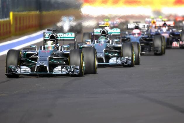 SOCHI, RUSSIA. OCTOBER 12, 2014. Mercedes Lewis Hamilton (front) of the UK drives during the 2014 Formula One Russian Grand Prix race at the Sochi Autodrom racing circuit. Sergei Savostyanov TASS  premiumd RE151A84