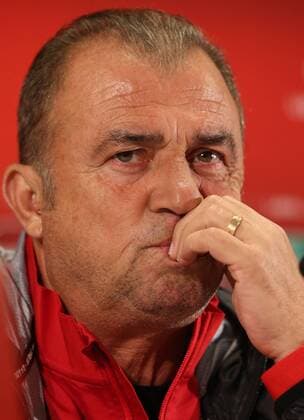 Turkey National Football Team head coach Fatih Terim and Player Gokhan Gonul during the press conference at Skonto Sadium in Riga on 12 October 2014 Pictured: Coach Fatih Terim 