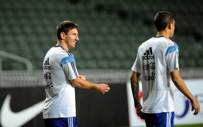 Lionel Messi, left, and his teammate of the Argentina s national mens football team take part in a training session  20141013_64677