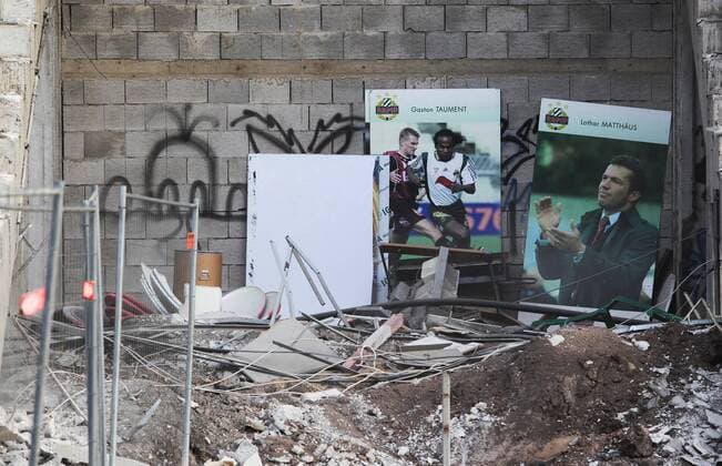 SOCCER - BL, Rapid, demolition Hanappi Stadium VIENNA,AUSTRIA,14.OCT.14 - SOCCER - tipico Bundesliga, SK Rapid Wien, demolition Gerhard Hanappi Stadium, teardown of the roof of the West stand. Image shows pictures of Gaston Taument and Lothar Matthaeus. 