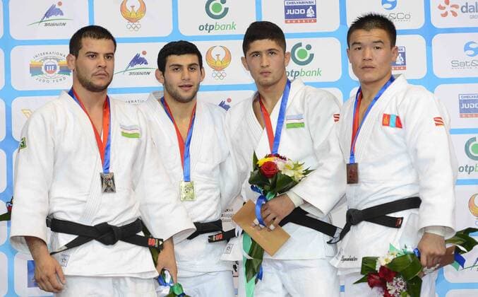 Gold medallist Roman Mustopoulos of Greece (2nd L), silver medallist Yakhyo Imamov of Uzbekistan (1st L) pose for photos during the award ceremony for Men s -81KG match at Tashkent 2014 Judo Grand Prix in Tashkent, Uzbekistan, on Oct. 17, 2014. ) (SP)UZBEKISTAN-TASHKENT-JUDO GRAND PRIX Sadat 