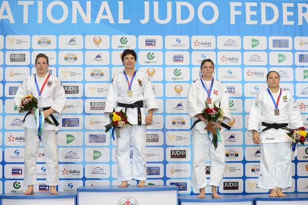 Gold medallist Laura Vargas Koch of Germany (2nd L), silver medallist Bernadette Graf of Austria (1st L) attend the award ceremony for Women s -70KG match at Tashkent 2014 Judo Grand Prix in Tashkent, Uzbekistan, on Oct. 17, 2014. ) (SP)UZBEKISTAN-TASHKENT-JUDO GRAND PRIX Sadat 