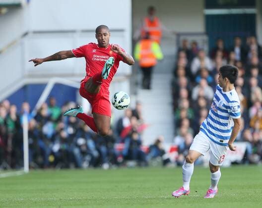 Liverpool s Glen Johnson in action - Barclays Premier League - QPR vs Liverpool - Loftus Road - England - 19th October 2014 - Picture David Klein Sportimage EDITORIAL USE ONLY. No use with unauthorised audio, video, data, fixture lists, club league logos or live services. Online in-match use limited to 120 images, no video emulation. No use in betting, games or single club league player publications.