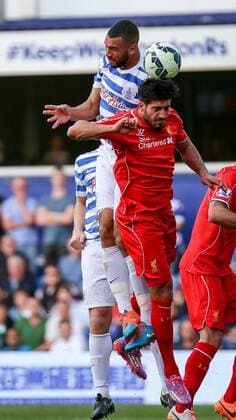 Football - 2014 2015 Premier League - Queens Park Rangers vs Liverpool Emre Can of Liverpool FC loses out in an aerial battle at Loftus Road Colorsport Daniel Bearham  QPR_LIV