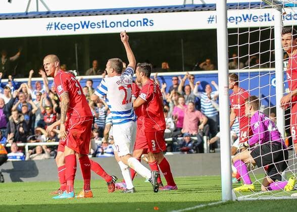 Football - 2014 2015 Premier League - Queens Park Rangers vs Liverpool, Richard Dunne of Queens Park Rangers appeals for the goal at Loftus Road Colorsport Daniel Bearham  QPR_LIV