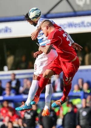 Football - 2014 2015 Premier League - Queens Park Rangers vs Liverpool, Martin Skrtel of Liverpool FC and Armand Traore of Queens Park Rangers at Loftus Road Colorsport Daniel Bearham  QPR_LIV