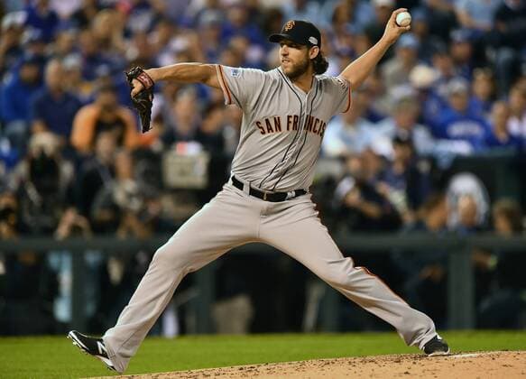 San Francisco Giants starting pitcher Madison Bumgarner throws against the Kansas City Royals in the first inning of game 1 of the World Series at Kaufman Stadium in Kansas City, Missouri on October 21, 2014.  KCP2014102114