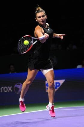 Romania s Simona Halep hits a return during the round robin match of WTA Tennis Damen finals at Singapore Indoor Stadium, Oct. 22, 2014. ThenxChihxWey 