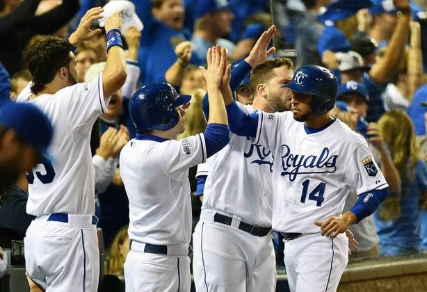 Kansas City Royals second baseman Omar Infante (14) celebrates scoring on teammate Alcides Escobar s double in the second inning against the San Francisco Giants in game 2 of the World Series at Kaufman Stadium in Kansas City, Missouri on October 22, 2014. San Francisco leads the series 1-0 over Kansas City.  KCP2014102227