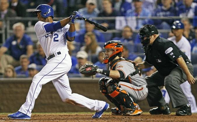 Kansas City Royals shortstop Alcides Escobar doubles home teammate Omar Infante against the San Francisco Giants during the second inning of game 2 of the World Series at Kaufman Stadium in Kansas City, Missouri on October 22, 2014. San Francisco leads the series 1-0 over Kansas City.  KCP2014102231