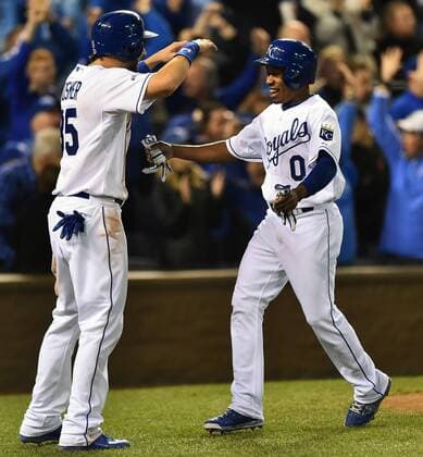 Kansas City Royals Eric Hosmer (L) and Terrence Gore celebrate scoring on teammate Salvador Perez s double against the San Francisco Giants during the sixth inning in game 2 of the World Series at Kaufman Stadium in Kansas City, Missouri on October 22, 2014. San Francisco holds a 1-0 series lead over Kansas City.  KCP2014102253