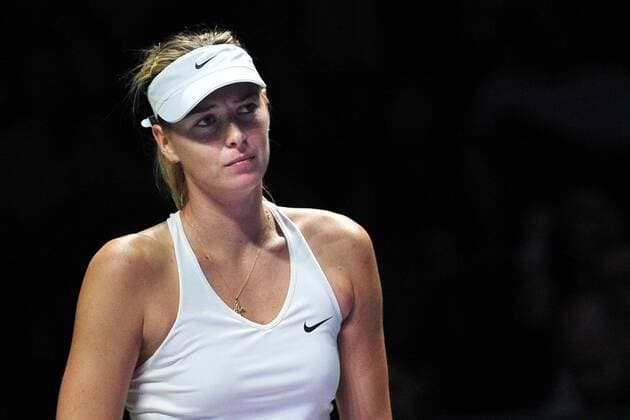 (141023) -- SINGAPORE, Oct. 23, 2014 -- Russia s Maria Sharapova reacts during the round robin match of the WTA Tennis Damen Finals at the Singapore Indoor Stadium, Oct. 23, 2014. ThenxChihxWey 