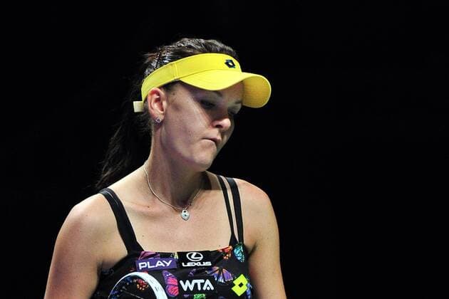 Poland s Agnieszka Radwanska reacts during the white group round robin match at the WTA Tennis Damen Finals at the Singapore Indoor Stadium, Oct. 24, 2014. ThenxChihxWey 
