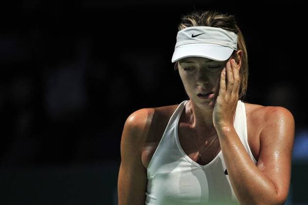 Russia s Maria Sharapova reacts during the white group round robin match at the WTA Tennis Damen Finals at the Singapore Indoor Stadium, Oct. 24, 2014. ThenxChihxWey 