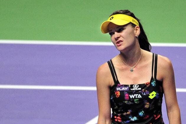 Poland s Agnieszka Radwanska reacts during the white group round robin match at the WTA Tennis Damen Finals at the Singapore Indoor Stadium, Oct. 24, 2014. ThenxChihxWey 