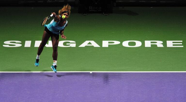 (141025) -- SINGAPORE, Oct. 25, 2014 -- Serena Williams of the United States serves during the women s singles semifinal match at the Singapore Indoor Stadium on Oct. 25, 2014. ThenxChihxWey 