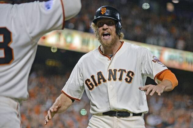 San Francisco Giants right fielder Hunter Pence (R) celebrates with third baseman Pablo Sandoval after both scored in the eighth inning on teammate s Juan Perez s double against the Kansas City Royals during game 5 of the World Series at AT&T Park in San Francisco on October 26, 2014. The Royals and Giants are tied 2-2 in the series.  SXP2014102639
