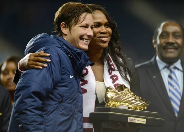 Oct. 26, 2014 - Chester, PA, USA - 20141026 - USA forward Abby Wambach, left, accepts the Golden Boot award during the medal ceremony for the CONCACAF women s World Cup qualifying final at PPL Park in Chester, Pa. The USA defeated Costa Rica in the CONCACAF final, 6-0. CHESTER, PA 2014 - USA v Costa Rica women s soccer World Cup Qualifier Final - ZUMAm139