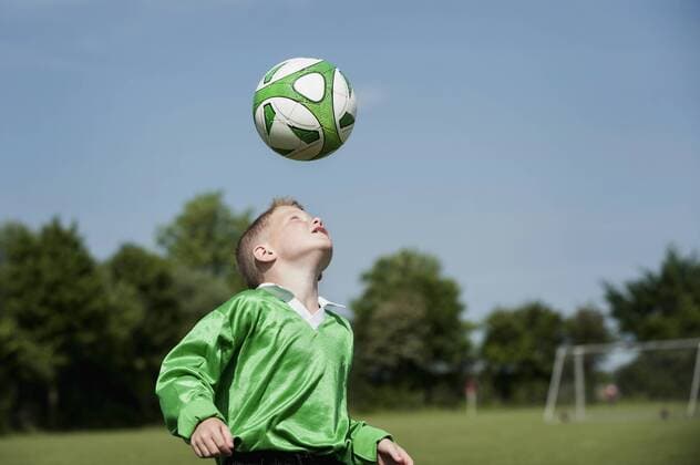 Young boy soccer practice football header ball mit_2003_01850