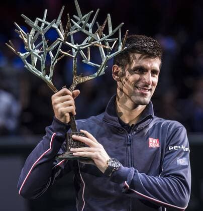 (141103) -- PARIS, Nov. 2, 2014 -- Novak Djokovic of Serbia holds up the trophy during the awarding ceremony after the men s singles final match at the ATP Tennis Herren World Tour Masters 1000 indoor tennis tournament at the Bercy Palais-Omnisport in Paris, France, Nov. 2, 2014. ChenxXiaowei 