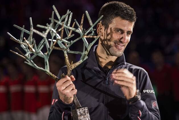 (141103) -- PARIS, Nov. 2, 2014 -- Novak Djokovic of Serbia reacts during the awarding ceremony after the men s singles final match at the ATP Tennis Herren World Tour Masters 1000 indoor tennis tournament at the Bercy Palais-Omnisport in Paris, France, Nov. 2, 2014. ChenxXiaowei 