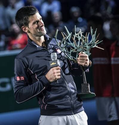 (141103) -- PARIS, Nov. 2, 2014 -- Novak Djokovic of Serbia reacts during the awarding ceremony after the men s singles final match at the ATP Tennis Herren World Tour Masters 1000 indoor tennis tournament at the Bercy Palais-Omnisport in Paris, France, Nov. 2, 2014. ChenxXiaowei 