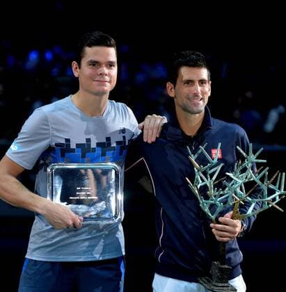 (141103) -- PARIS, Nov. 2, 2014 -- Novak Djokovic (R) of Serbia and Milos Raonic of Canada pose for photograph during the awarding ceremony after the men s singles final match at the ATP Tennis Herren World Tour Masters 1000 indoor tennis tournament at the Bercy Palais-Omnisport in Paris, France, Nov. 2, 2014. ChenxXiaowei 