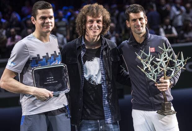 (141103) -- PARIS, Nov. 2, 2014 -- Novak Djokovic (R) of Serbia, Milos Raonic (L) of Canada and Paris St Germain s David Luiz pose for photograph during the awarding ceremony after the men s singles final match at the ATP Tennis Herren World Tour Masters 1000 indoor tennis tournament at the Bercy Palais-Omnisport in Paris, France, Nov. 2, 2014. Novak Djokovic won 2-0 to claim the champion. ) (SP)FRANCE-PARIS-TENNIS-ATP-MASTERS ChenxXiaowei 