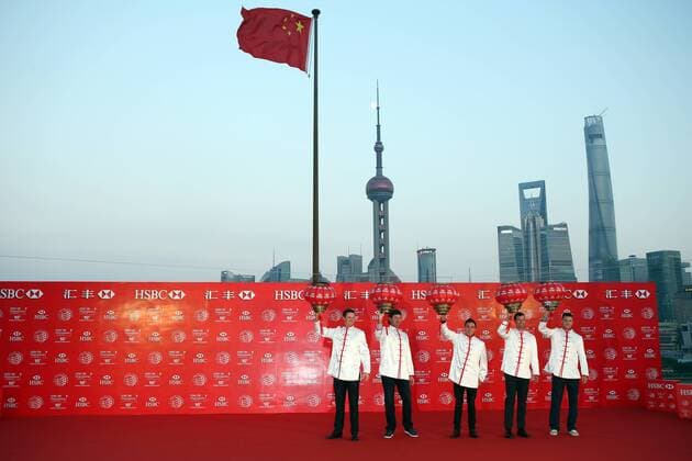 (From left) Justin Rose of England, Bubba Watson and Rickie Fowler of the United States, Adam Scott of Australia and Martin Kaymer of Germany, all dressed in Chinese folk costumes tangzhuang, pose at the opening ceremony of the WGC HSBC Champions golf tournament on the Bund in Shanghai, China, 4 November 2014. Golfers tee off HSBC Champions golf tournament in Shanghai  20141104_14184