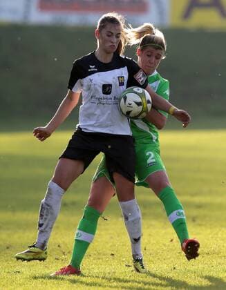 SOCCER - CL, Neulengbach vs Wolfsburg NEULENGBACH,AUSTRIA,09.NOV.14 - SOCCER - UEFA Champions League, Women, NOESV Neulengbach vs VfL Wolfsburg. Image shows Jelena Prvulovic (Neulengbach) and Luisa Wensing (Wolfsburg). 