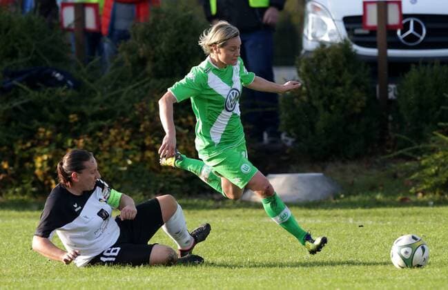 SOCCER - CL, Neulengbach vs Wolfsburg NEULENGBACH,AUSTRIA,09.NOV.14 - SOCCER - UEFA Champions League, Women, NOESV Neulengbach vs VfL Wolfsburg. Image shows Natscha Celouch (Neulengbach) and Martina Mueller (Wolfsburg). 