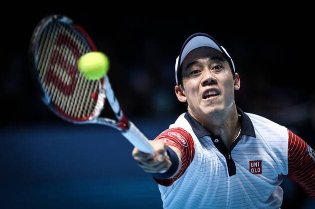 Kei Nishikori of Japan hits a return during the ATP Tennis Herren World Tour Finals Group B match in London, Britain, on Nov. 9, 2014. (SP)BRITAIN-LONDON-TENNIS-ATP WORLD TOUR FINALS TangxShi 