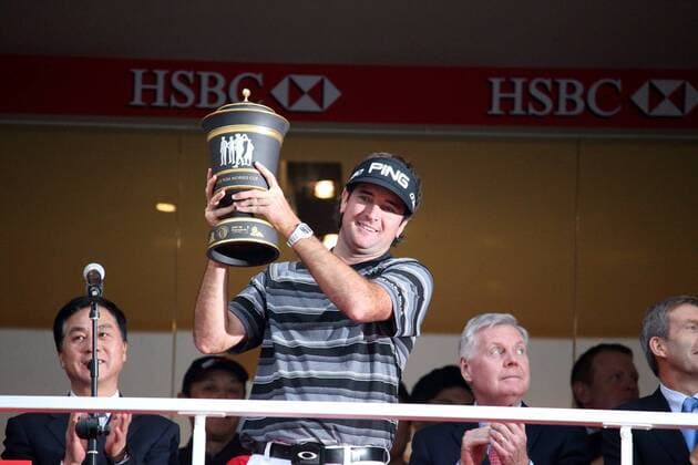 Bubba Watson of the United States, center, celebrates with his champion trophy during the award ceremony of the WGC HSBC Champions golf tournament at the Sheshan International Golf Club in Shanghai, China, 9 November 2014. Bubba Watson wins his 1st World Golf Championship in Shanghai  pbu184836_04